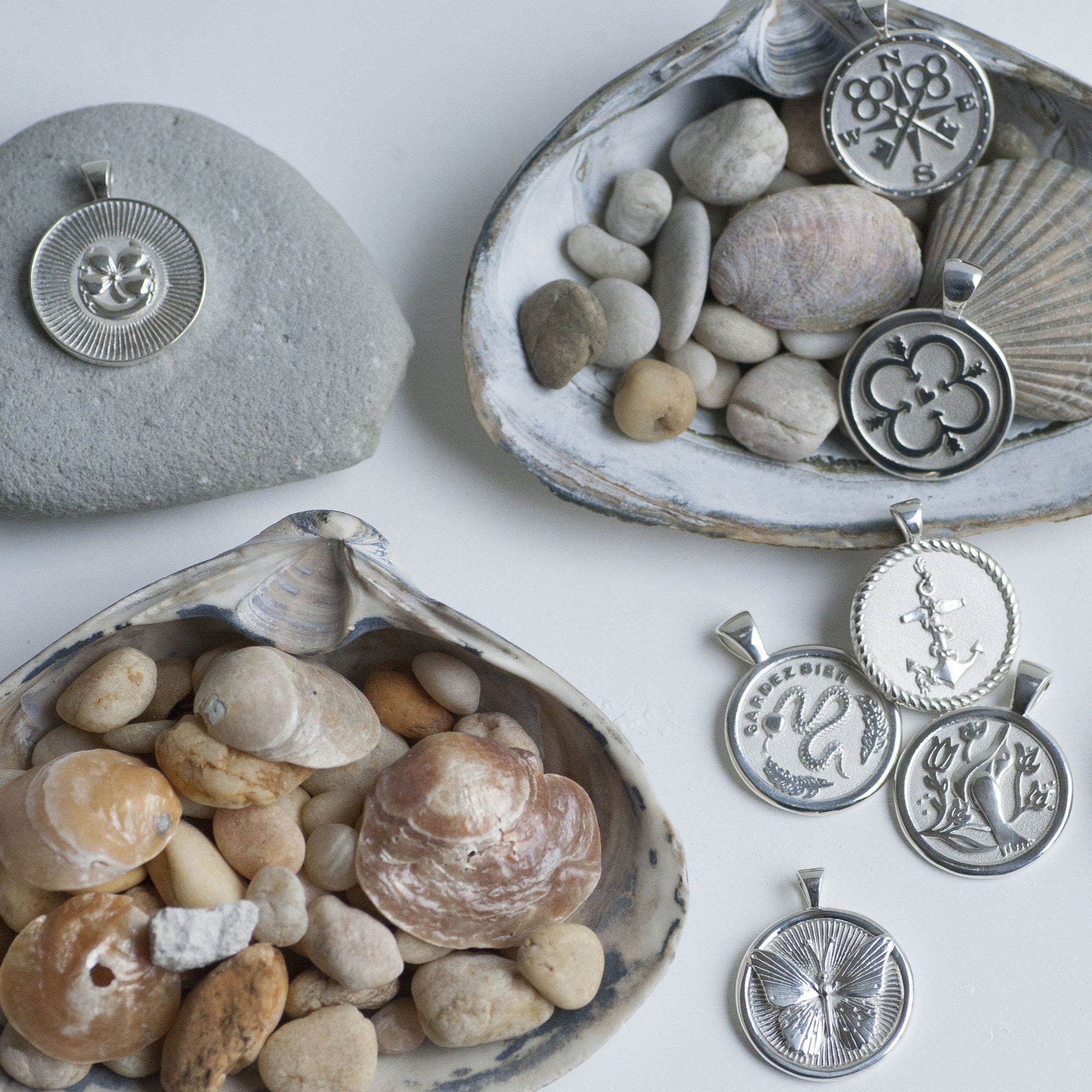 Silver coins styled with seashells