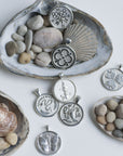 Stylized shot of silver coins with seashells