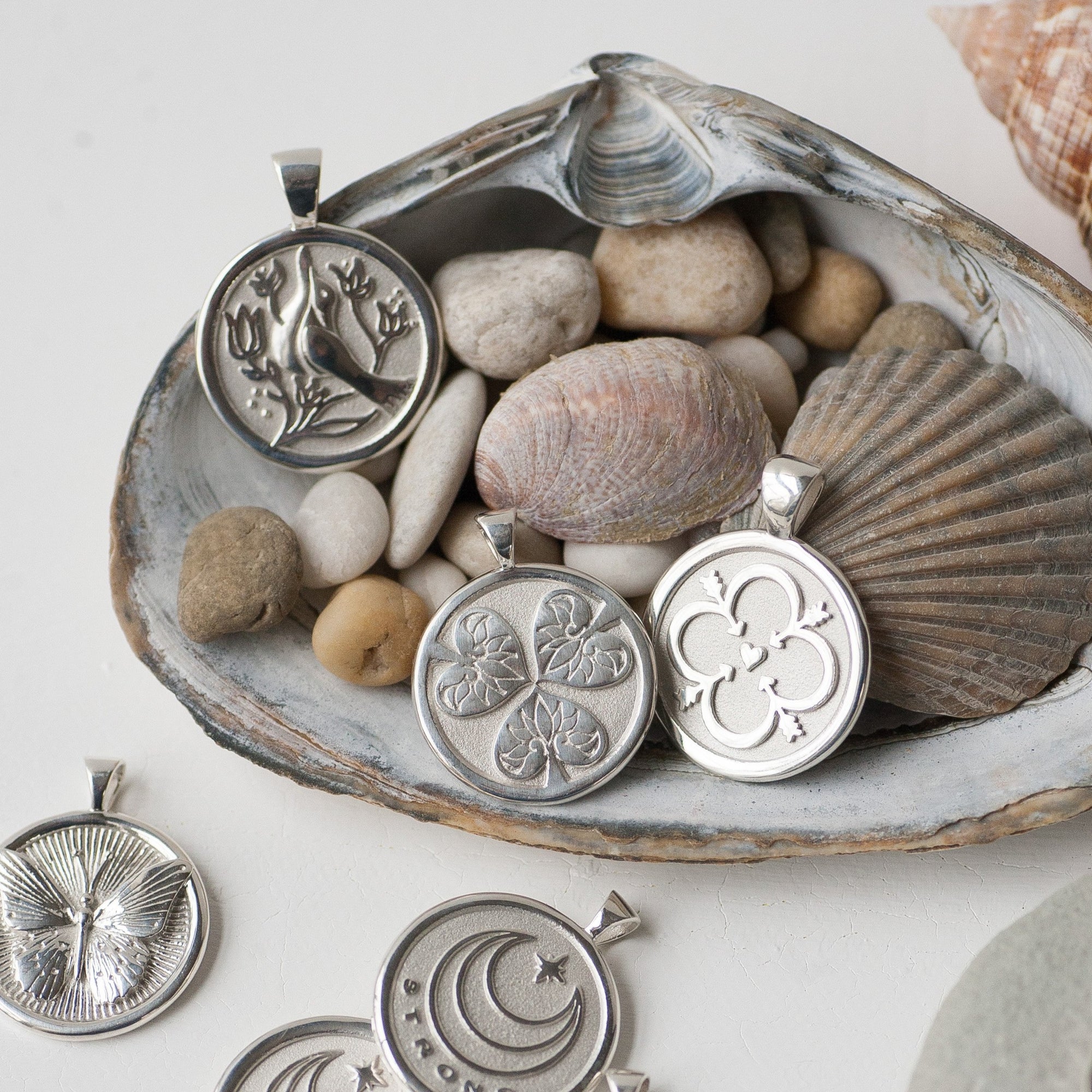 Silver coins stylized with seashells