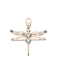 Gold dragonfly pendant featuring aquamarine and blue topaz accents