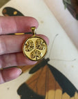 Video of Gold Coin Shown Front (3 hollyhock leaves) and back (word JOY)