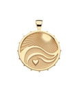 Gold coin pendant with illustration of the rays of the sun, waves, and a heart