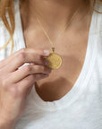 Model wearing gold original Taurus coin pendant