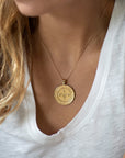 Model wearing gold original Virgo coin pendant