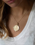 Model wearing gold original Sagittarius coin pendant