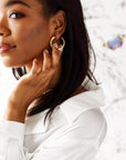 Model wearing the protect tusk hoops