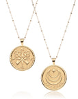 Gold Coin Pendant with Compass and Key design (front) and Moon and Star Logo and word FOREVER underneath (back)