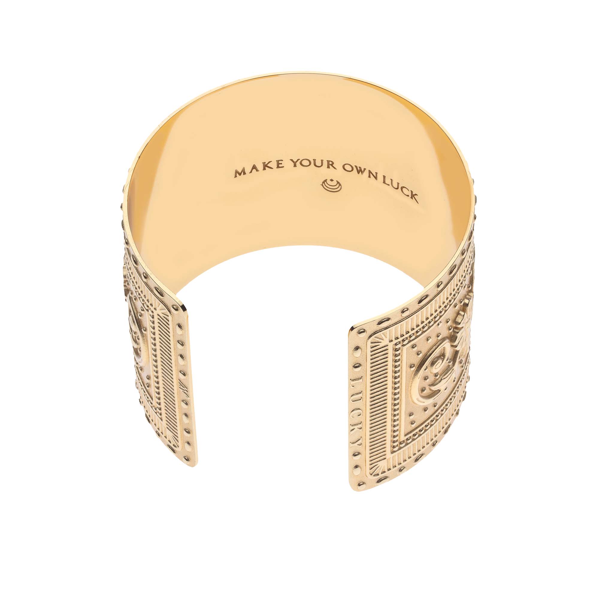 Gold horseshoe cuff says "Make your own luck" inside