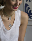 Silver Coin Necklaces Layered on Model