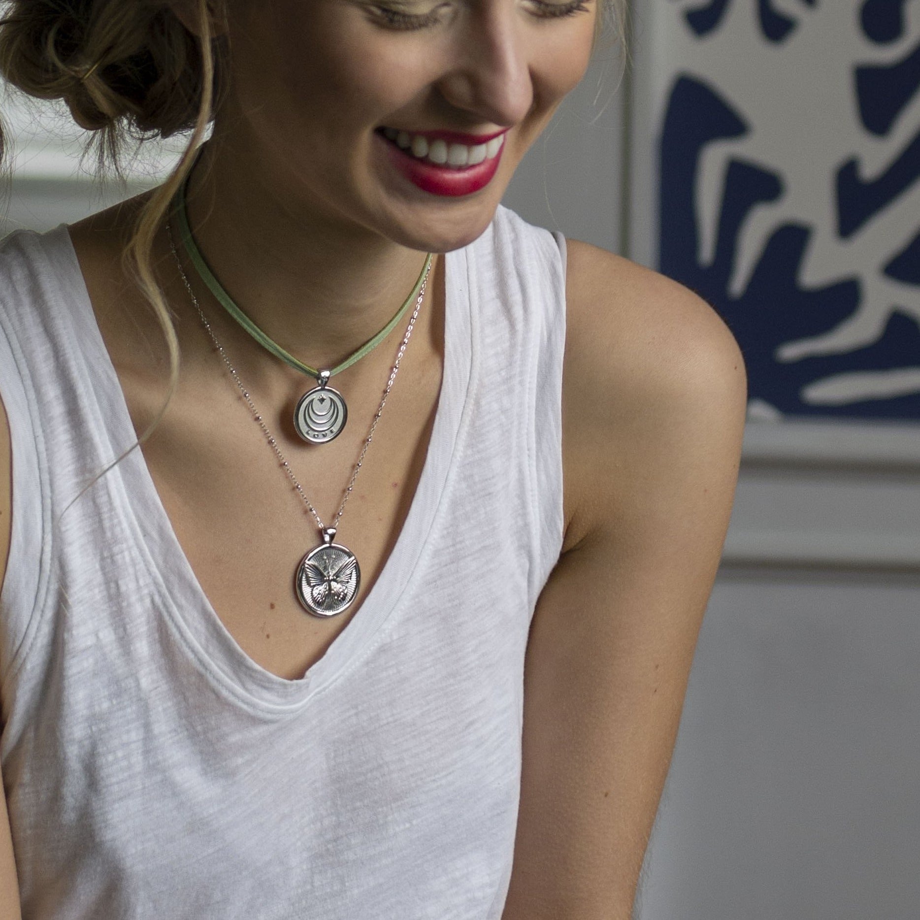 Model wearing layered silver coins