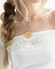 Gold necklaces layered on model