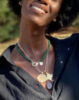 Model wearing gold original Sagittarius coin