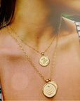 Gold Coin Necklaces Layered on Model