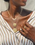 Gold Coin Necklaces Layered on Model