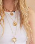 Gold Coin Necklaces Layered on Model
