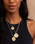 Gold Coin Necklaces Layered on Model