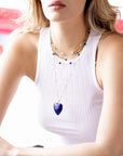 Layered heart necklaces on model