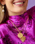Gold Coin Necklaces Layered on Model
