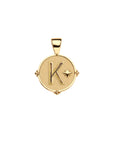 Gold letter K coin pendant with star detail