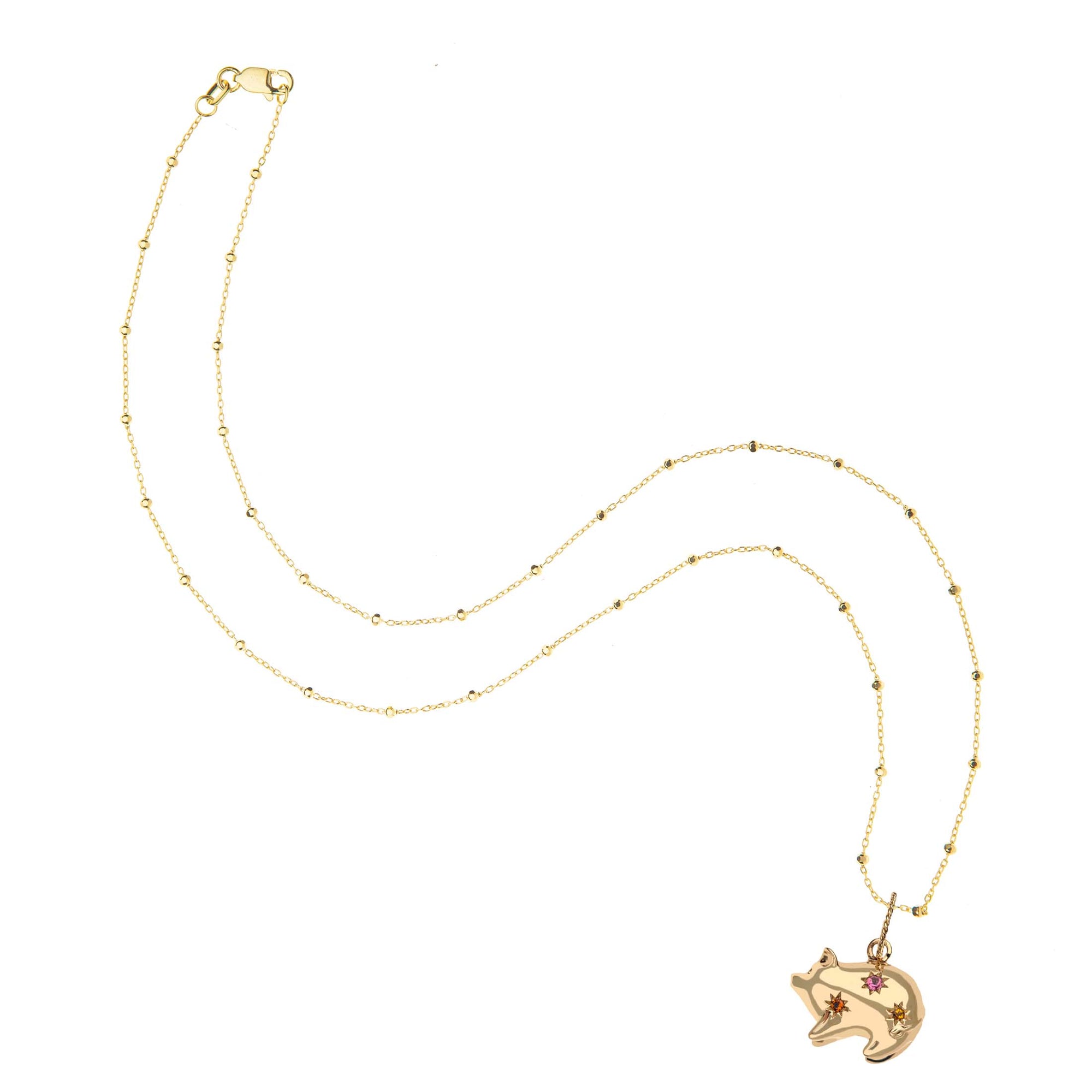 Gold pig pendant on 14 karat satellite chain