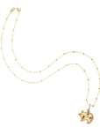 Gold pig pendant on 14 karat satellite chain