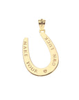 Gold horseshoe pendant with "Make your own luck" on the back with a small heart