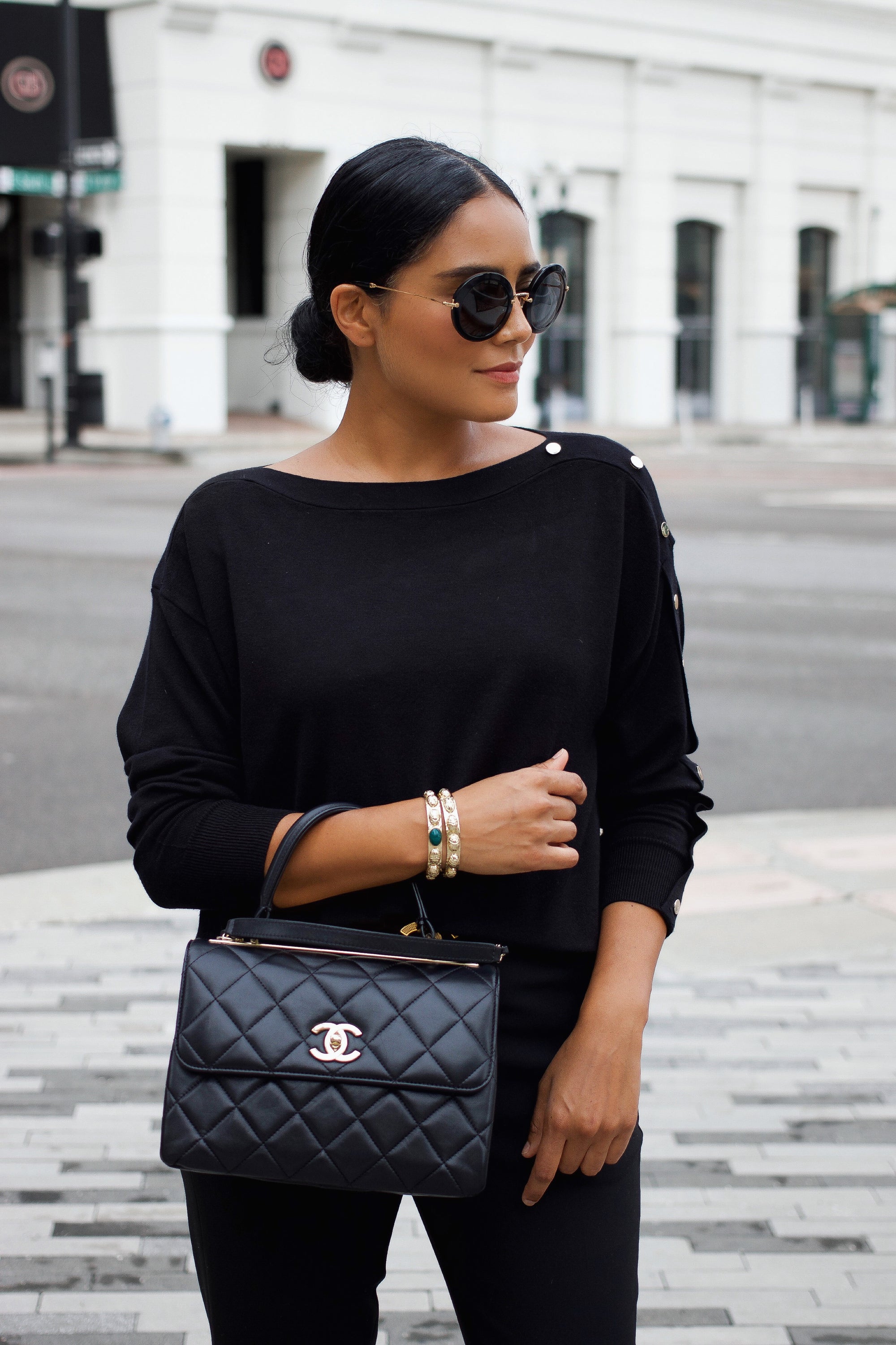 Model wearing gold scarab cuff