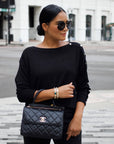 Model wearing gold scarab cuff