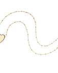 Gold heart pendant on satellite chain
