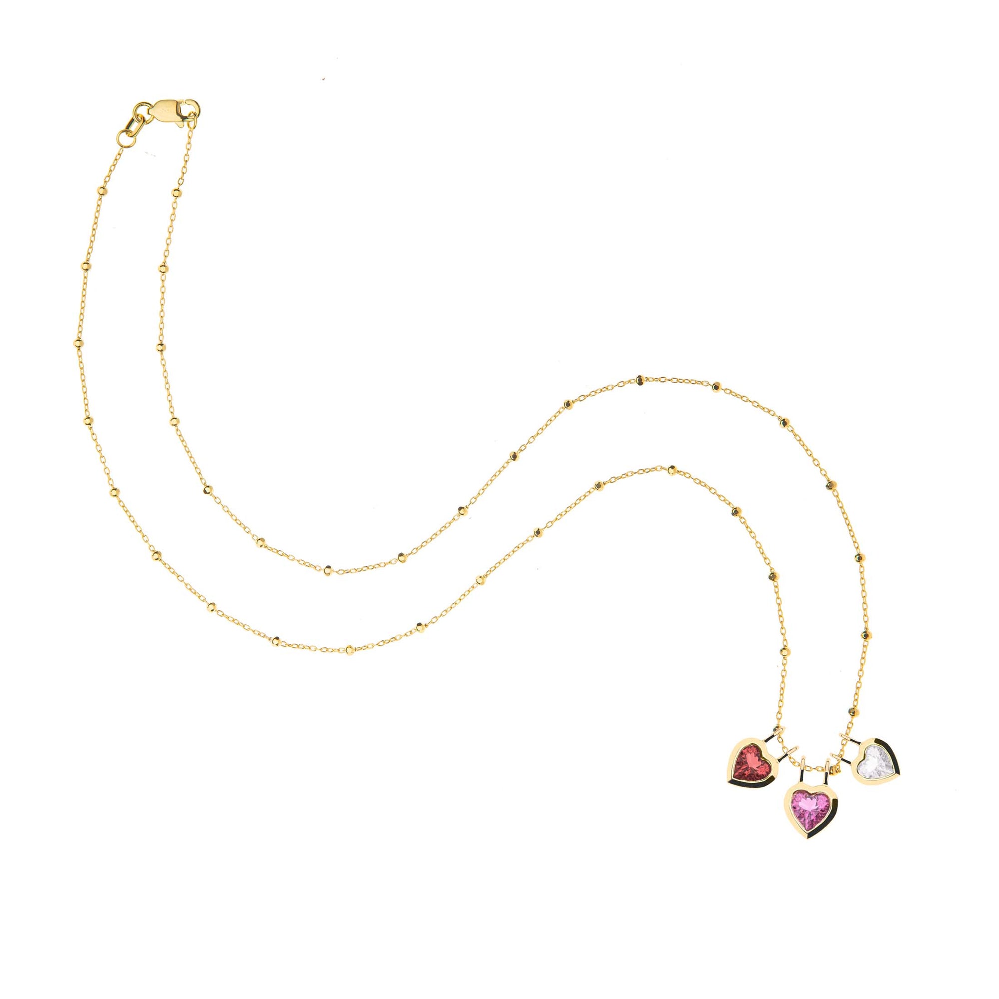 Three heart pendants on 18 karat beaded satellite chain