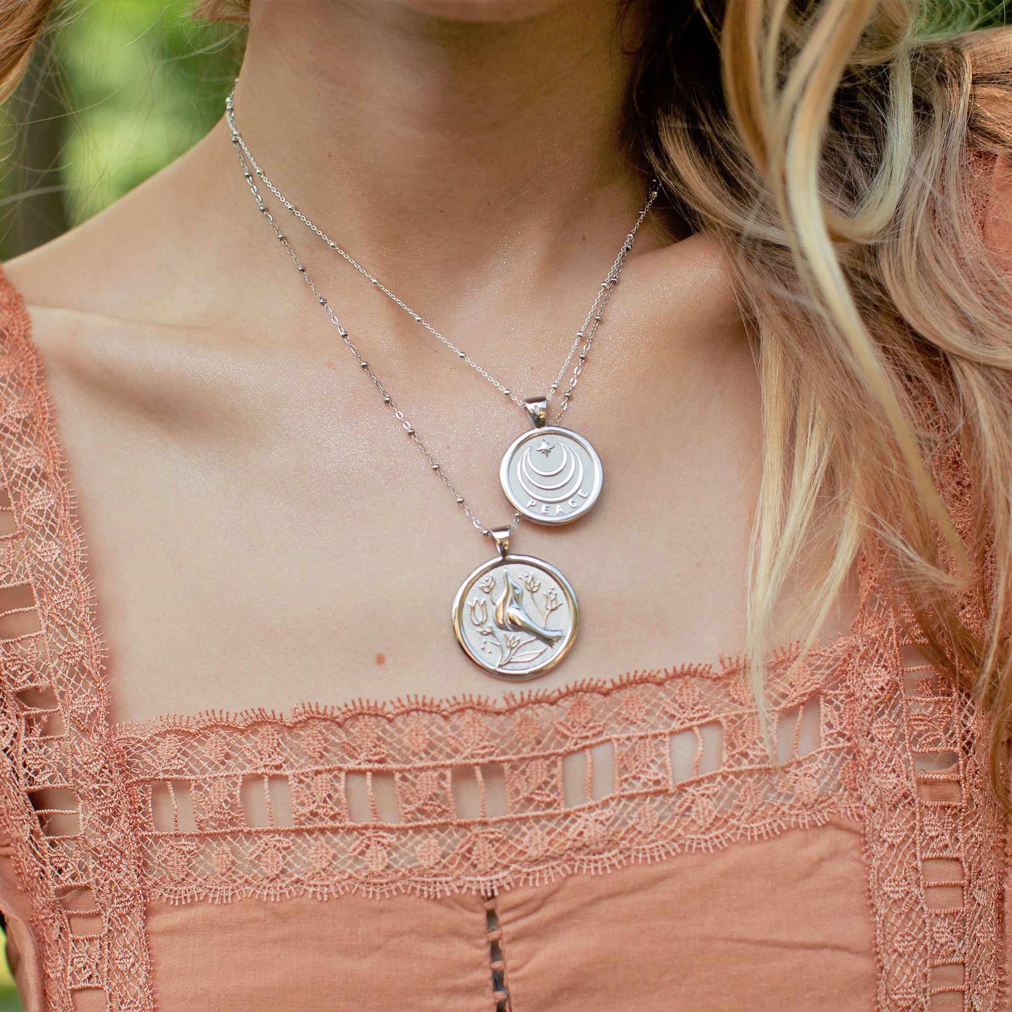 Silver Coin Necklaces Layered on Model