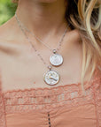 Silver Coin Necklaces Layered on Model