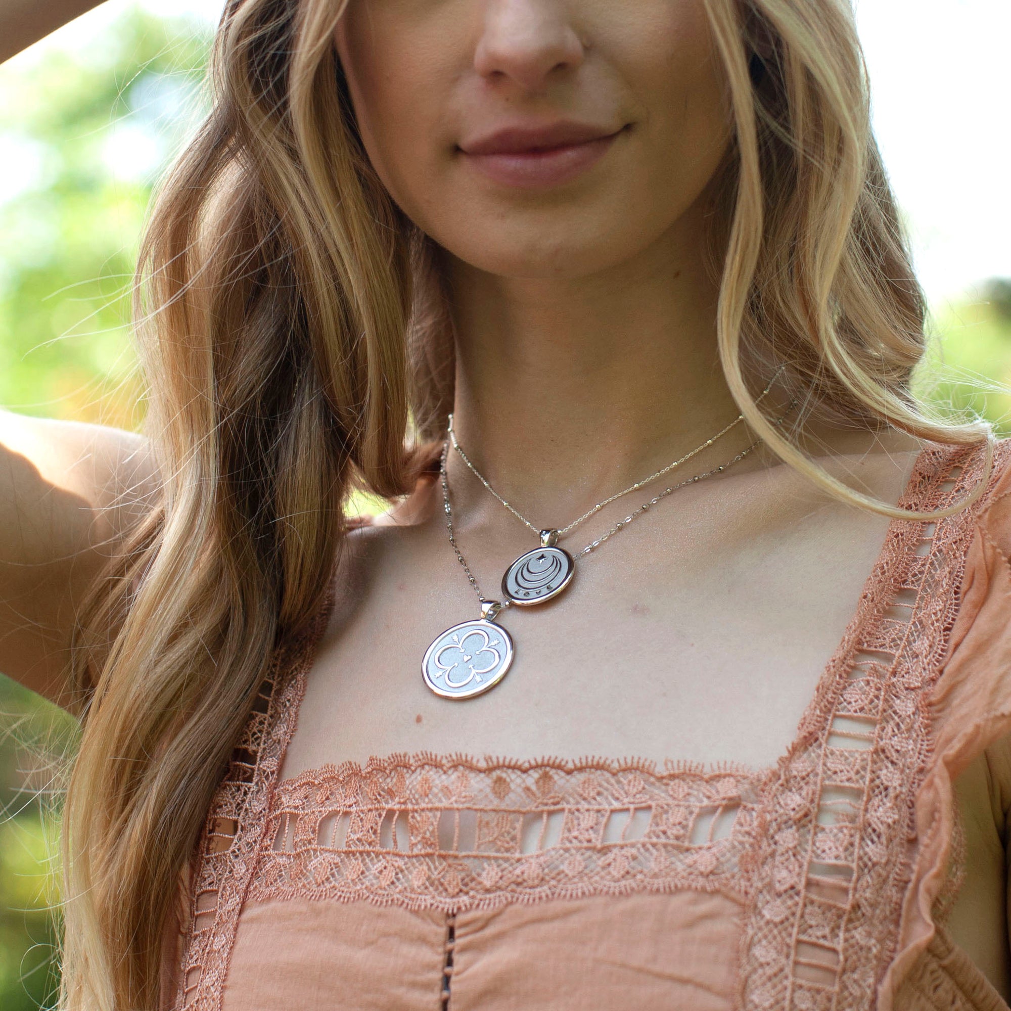 Silver Coin Necklaces Layered on Model