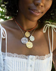 Gold and Silver Necklaces Layered on Model