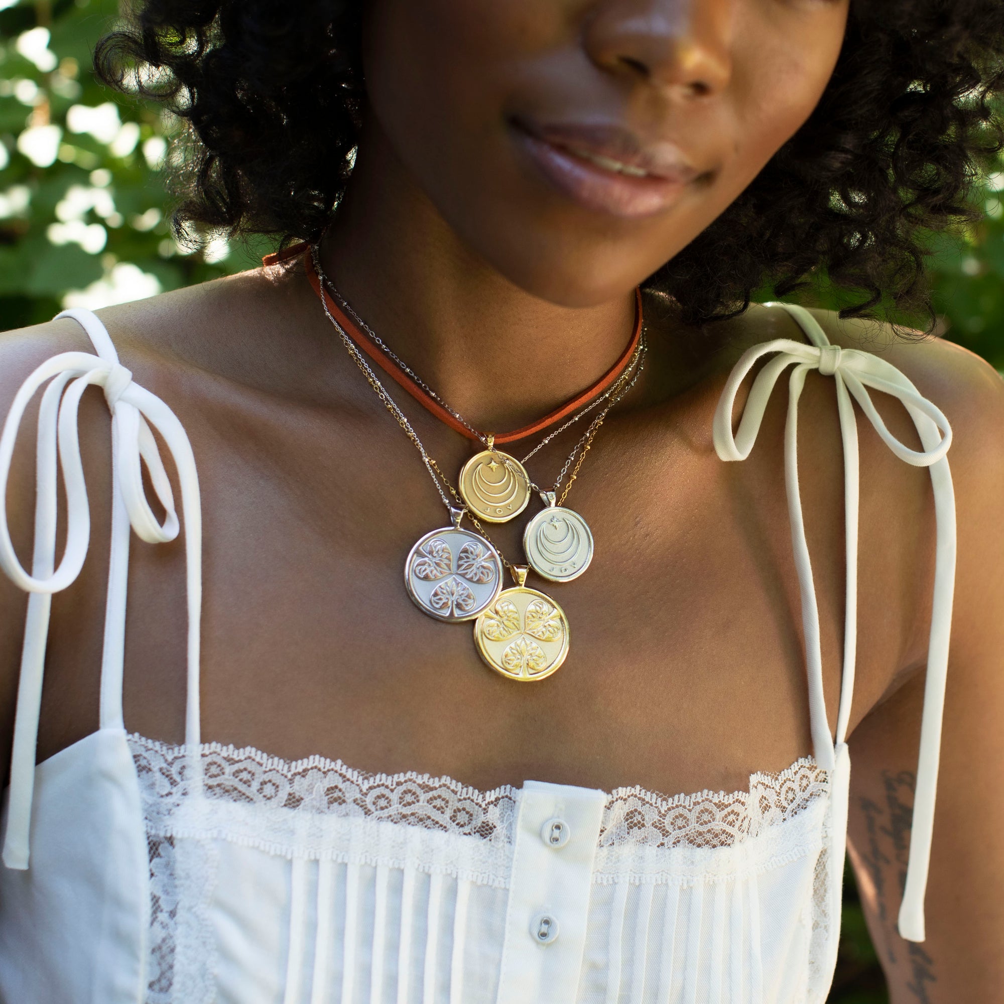 Silver and gold coins layered on model