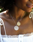 Silver and Gold Coin Necklaces Layered on Model