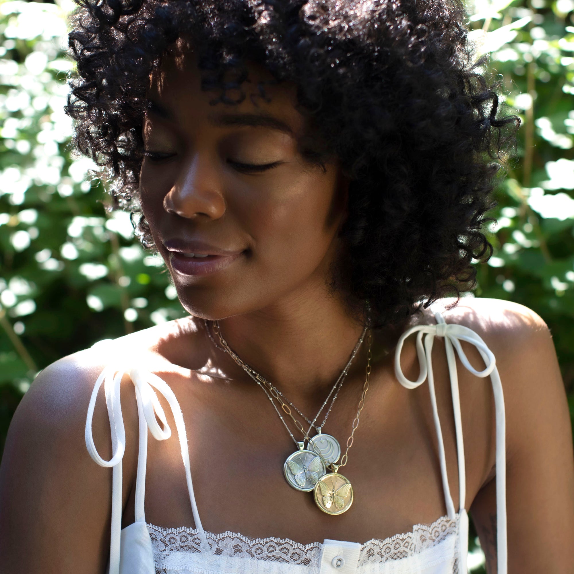 Silver Coin Necklaces Layered on Model