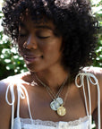 Silver Coin Necklaces Layered on Model