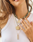 Model wearing wanderlust coins and seaglass necklace