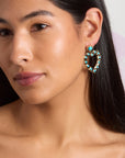 Model wearing the love in the sun earrings in turquoise