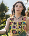 Model wearing layered evil eye pendants
