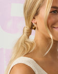 Model wearing the love you to the moon and stars earrings
