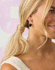 Model wearing the love you to the moon and stars earrings
