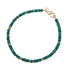 Beaded necklace featuring malachite beads with flat gold beads interspersed.  Necklace features oversized gold lobster clasp.
