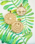 Stylized shot of gold coins with watercolor leaves 