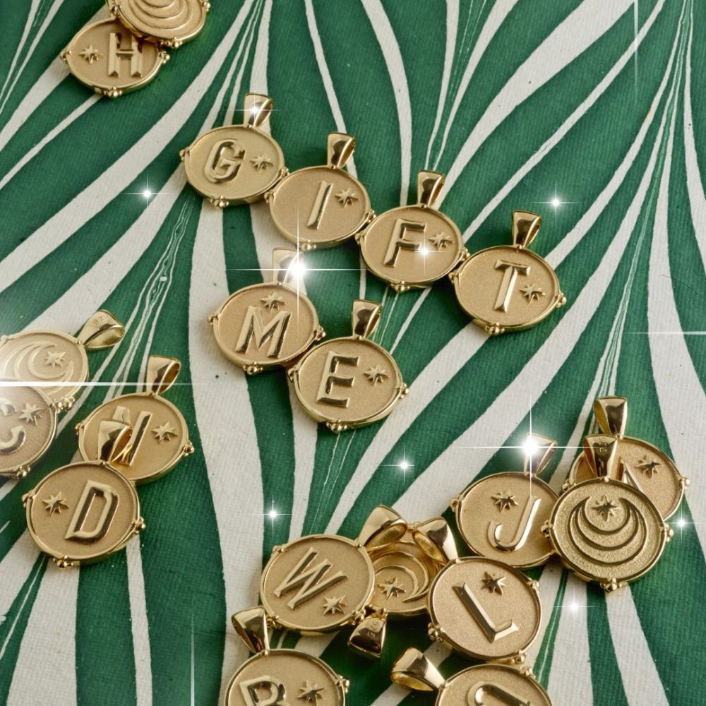 Multiple Jane Win letter pendant coins