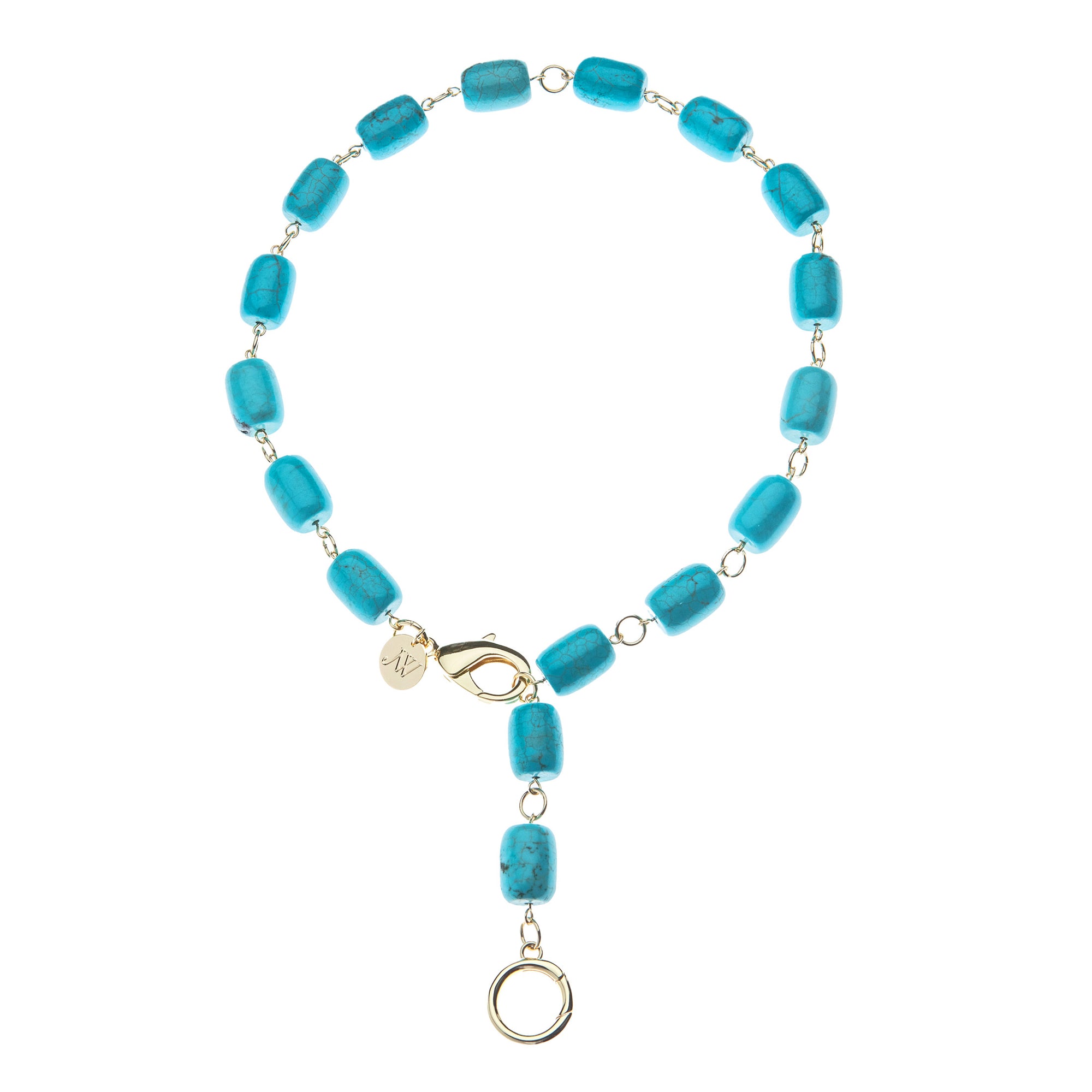 Necklace features chunky turquoise beads with oversize gold lobster clasp and ring to attach pendants. Shown as a lariat.
