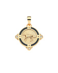 Gold coin pendant featuring galloping horse with border of black enamel and white topaz accents