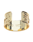 Inside of gold cuff bracelet features the phrase "A LIFE LIVED WITH COURAGE"