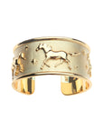 Gold cuff bracelet with galloping horses and star details